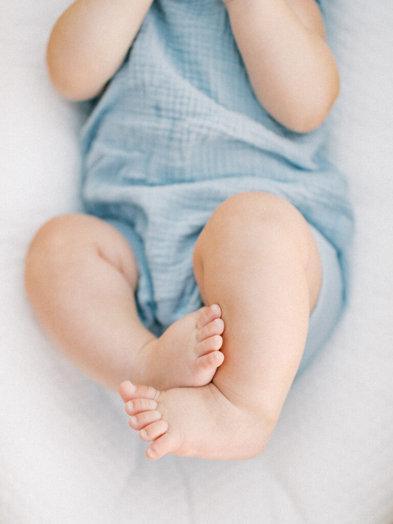 Baby feet curled up at sunset session