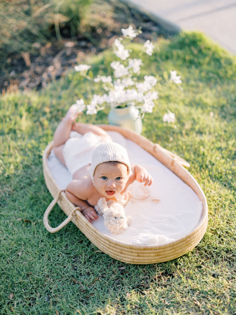 Baby basket photos Baby with bonnet on at sunset