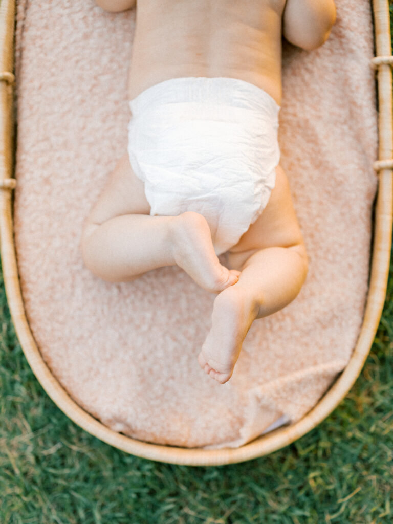 Baby basket photo showing only baby's legs